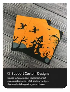 Detail of Halloween napkins featuring orange backgrounds with witch and castle silhouettes