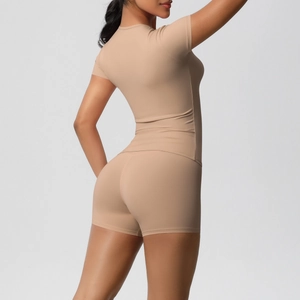 Close-up of nude-colored yoga set featuring high-elasticity fabric and slim-fit tailoring