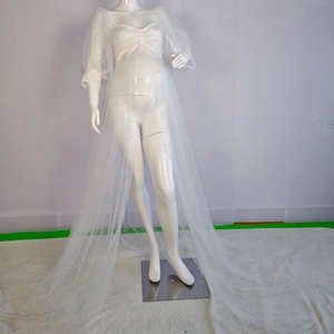 White tulle maternity gown with long sleeves and elegant pearl beads for photo shoots