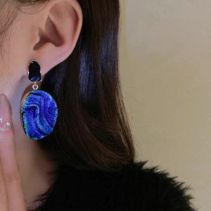 Vintage oval drop earrings with blue purple sand texture and black glaze accents