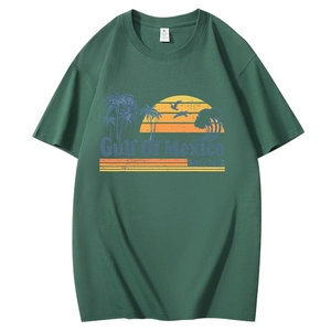 Close-up of green cotton T-shirt featuring vintage Gulf of Mexico sunset graphic print