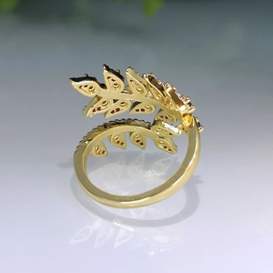 Elegant gold leaf open ring with sparkling red zircon stones in wheat ear design