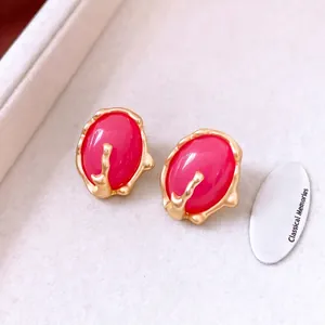 Vintage resin pleated oval pink stud earrings with textured matte gold base