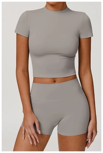 Close-up of light gray two-piece yoga set showing brushed texture and high waist detail