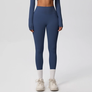 Detail of high-waisted navy blue yoga pants with quick-dry fabric and tummy control
