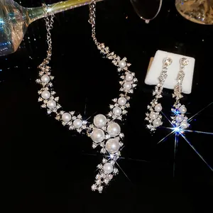Elegant pearl and diamond floral jewelry set including necklace and earrings for women