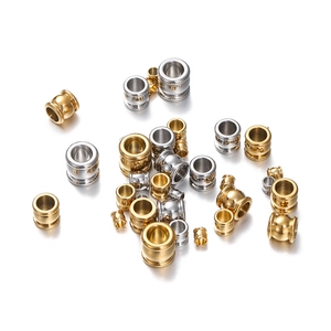 Close-up of gold and silver stainless steel spacer beads for DIY jewelry making