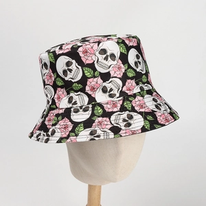 Detail of black bucket hat featuring white skull and pink rose floral print pattern