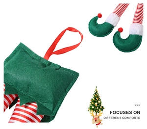Detail of Christmas elf legs with red and white stripes and green felt shoes