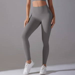 Close-up of grey high-waisted yoga pants showing seamless fabric and wide waistband