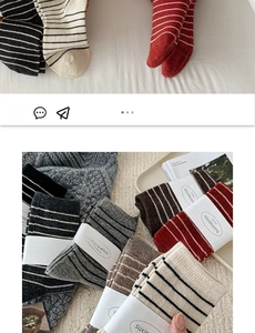 Detail view of thick wool blend socks featuring striped patterns and cable knit textures