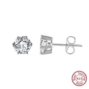 Detail view of 925 sterling silver earrings with six-prong setting and round zircon