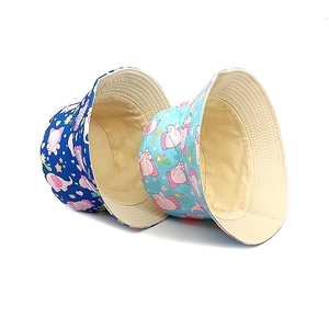 Kids reversible bucket hat set with cute pink elephant patterns in blue cotton fabric