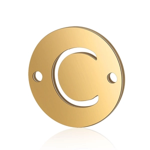 Close-up of golden stainless steel round letter C pendant with dual connector holes