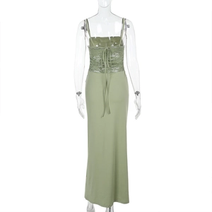 Detailed back view of light green lace dress featuring crisscross straps and slim fit