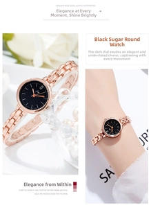 Detail of rose gold metal bracelet watch for women with minimalist black dial and jewelry