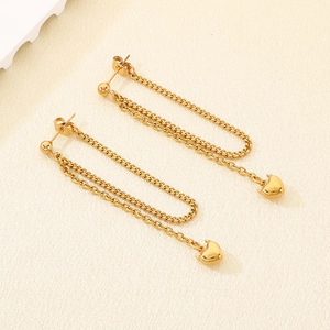 Detail of 18K gold-plated long chain tassel earrings with heart pendants and ball studs
