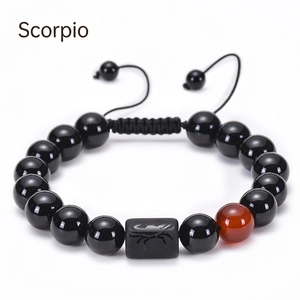Detailed view of Scorpio adjustable bracelet with black agate beads and engraved scorpion charm