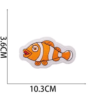 Detail of clownfish embroidery patch showing 10.3cm width and 3.6cm height dimensions