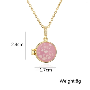 Detail of round gold-plated locket necklace with stone inlay including size and weight specs