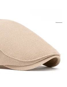 Detail of breathable mesh beret featuring a foldable wide brim for face contouring