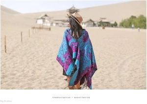 Ethnic cashmere shawl with paisley patterns and tassels for travel and warmth