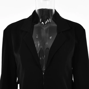 Detailed view of women's black long-sleeve blazer with a single hook-and-eye closure