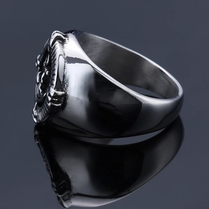 Macro shot of silver stainless steel anchor ring featuring detailed side relief patterns