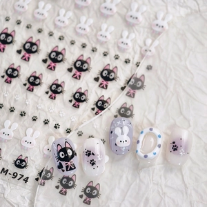 Minimalist black cat and white rabbit nail art stickers with paw prints and cute bow details