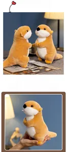 Close-up of cute plush sea otter toy showing soft texture and cozy desktop setting
