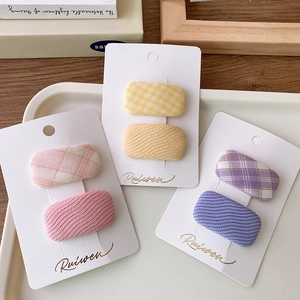 Set of pastel plaid and textured fabric square hair clips in pink yellow and purple