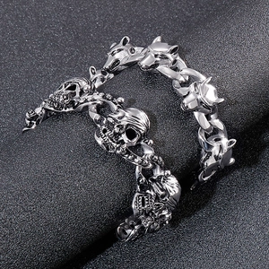 Punk style stainless steel men's bracelet with skull and wolf head designs on dark background