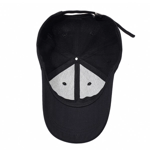Inside view of black cotton baseball cap showing reinforced front panel and metal buckle