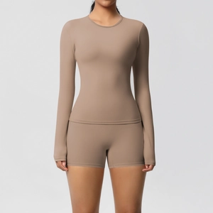 Detail of high-elasticity brushed fabric on a brown long-sleeve yoga set for women