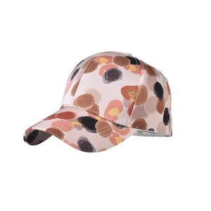 Pink satin baseball hat with colorful abstract dots and curved brim on white background
