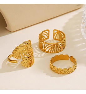 Detailed trio of 18K gold plated rings featuring tropical leaf and hollow geometric patterns