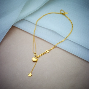 Exquisite gold double chain necklace featuring heart and sparkling star tassel pendants