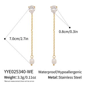 Detail view of gold stainless steel pearl drop earrings with 7cm length measurements