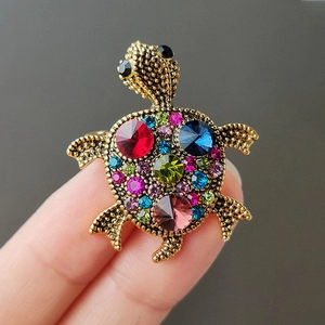Exquisite turtle brooch with colorful rhinestones on a vintage gold-tone metal base
