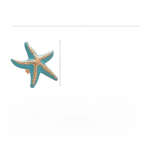 Macro detail of starfish ring featuring blue enamel coating and golden relief textures