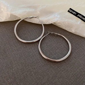 Minimalist silver geometric hoop earrings in a polished metallic finish for women