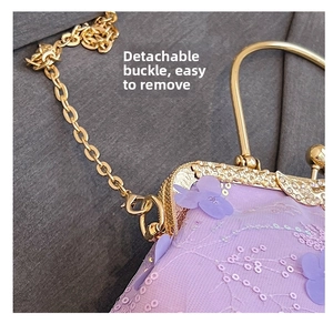 Close-up of the detachable gold clasp and chain on a purple mesh shell bag