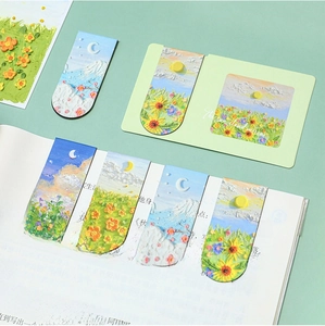 Detail of oil painting magnetic bookmarks with 3D embossed textures on an open book