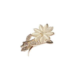 Elegant gold butterfly hair claw clip with cat eye stone petals and rhinestone accents