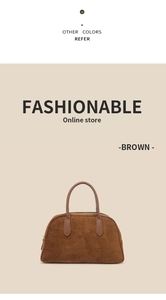 Detailed close-up of brown suede Boston handbag with leather handles and silver zipper