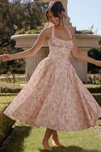 Detail of floral print pattern and halter neck design on a summer midi dress