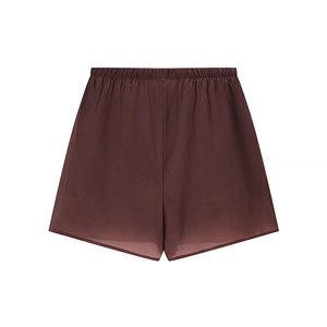 Detail of coffee brown silk shorts featuring elastic waistband and smooth satin texture