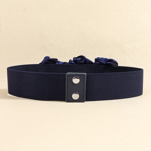 Close-up of navy blue elastic belt with fabric rose flower and silver snap buttons