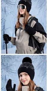 Detailed view of women's warm knitted hat with fur pompom and matching touchscreen gloves