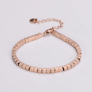 Macro shot of rose gold square link bracelet in polished finish with adjustable chain